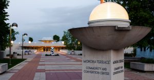 The sign and walkway leading up to the Monona community and convention center.