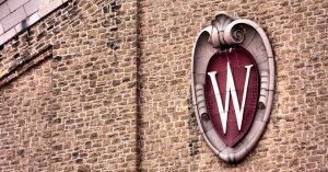 The University of Wisconson-Madison crest on a brick wall.