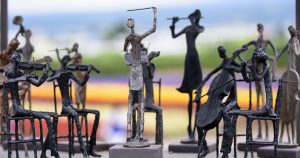 A sculpture of an orchestra playing an outdoor performance.