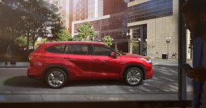 A red 2020 Toyota Highlander Hybrid.