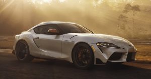 The new 2020 Toyota GR Supra sitting in the hazy morning light.