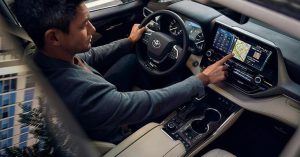 A man driving the all new 2020 Toyota Highlander.