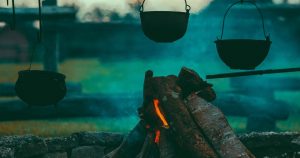 A campfire from an early morning campsite.