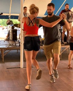 Young couple polka dancing at Polkafest in New Glarus Wisconsin