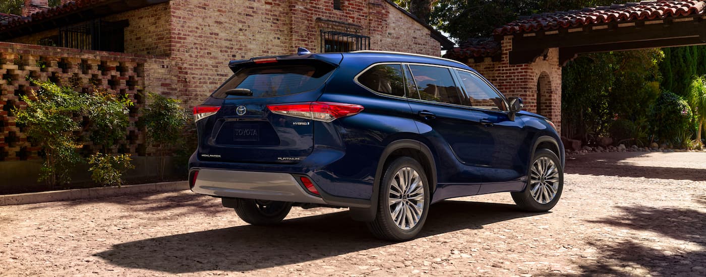 Rear view of a blue 2023 Toyota Highlander Hybrid