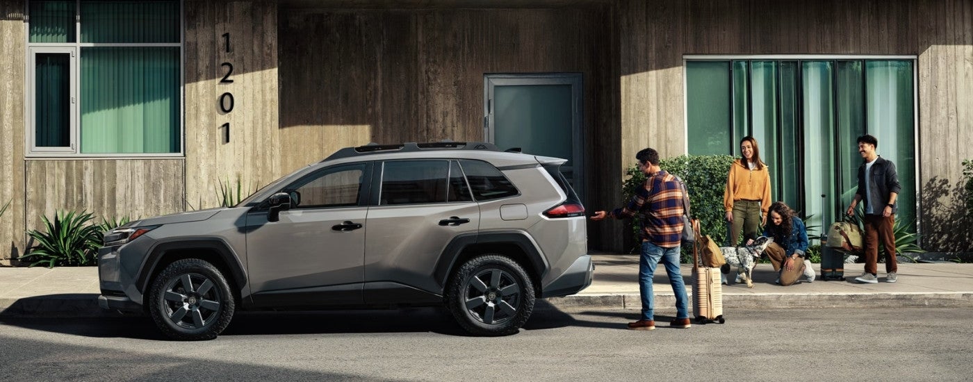 A grey 2025 Toyota RAV4 from the side.