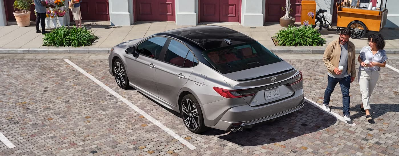 Grey 2025 Toyota Camry parked at a Toyota dealer