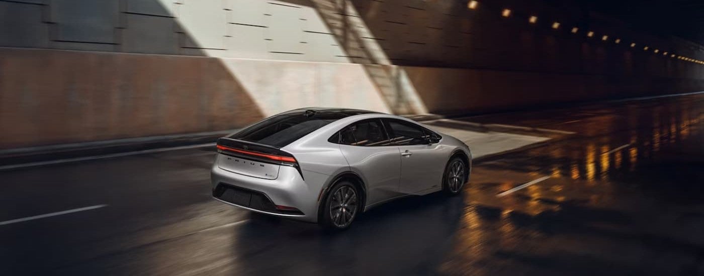 A white 2026 Toyota Prius driving in a tunnel.