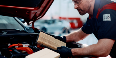 Toyota-trained technician servicing a vehicle at Smart Motors Toyota